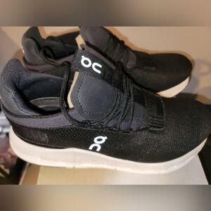 On Running Black Sneakers with Breathable Mesh and Unique Lacing System